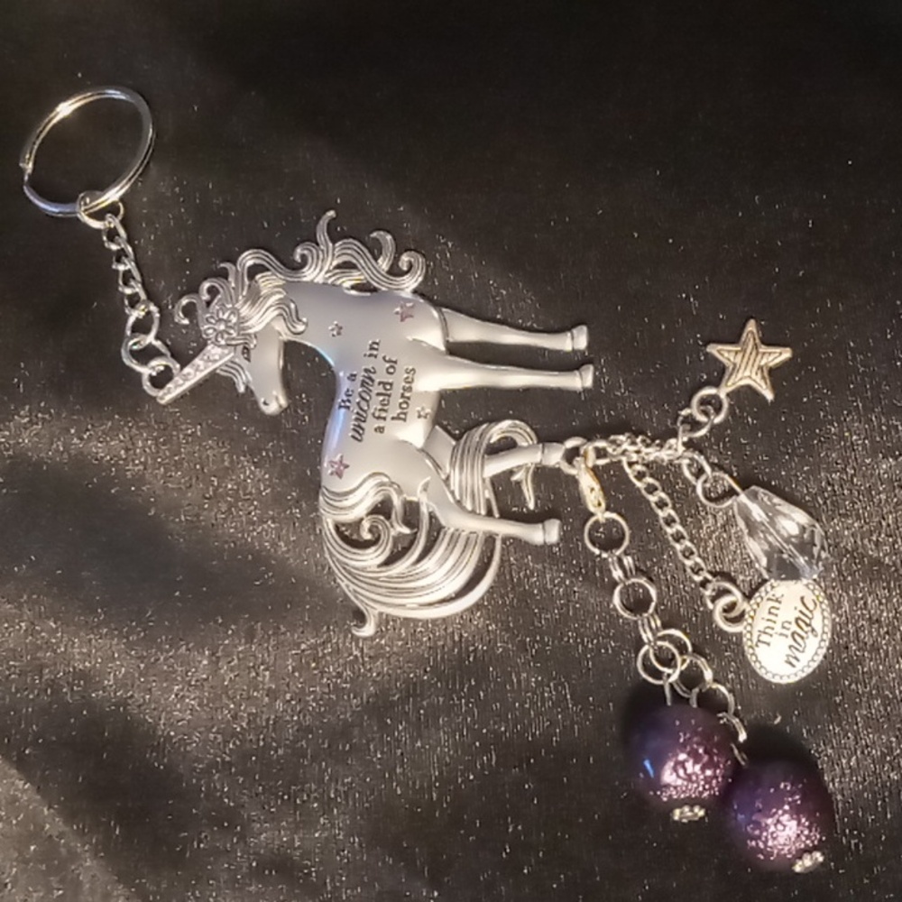 Unicorn key chain inspirational with tassels.